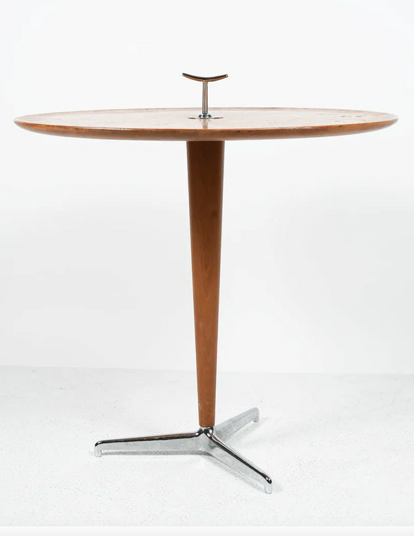 Wooden table with a metal base on a white background