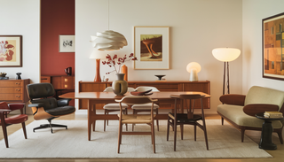Mid-Century Modern dining room featuring iconic furniture pieces like Eames Lounge Chair, Wishbone Chairs, and a Vladimir Kagan sofa, with warm lighting and vintage decor.