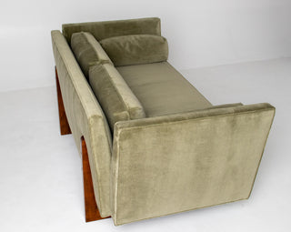 Sage Green velvet sofa with split arms and wooden legs