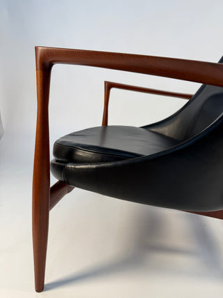 profile of elizabeth chair in teak and black leather 