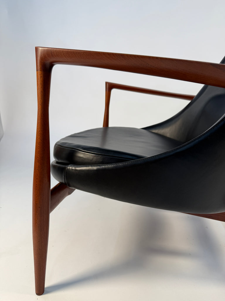 profile of elizabeth chair in teak and black leather 