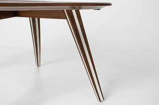 Close-up of tapered splayed walnut legs with cream inlay stripe on Filippo Chissotti Italian modernist coffee table, mid-century design detail