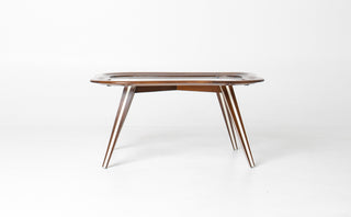 Underside view of Filippo Chissotti table showing eight splay-legged walnut base construction with paired legs at each corner and structural apron, Italian postwar furniture