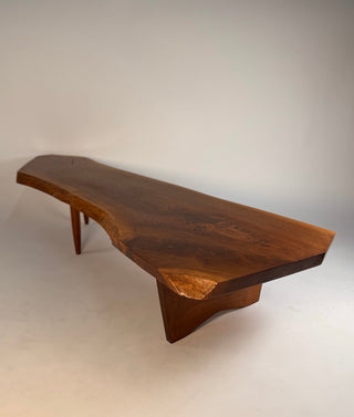 full shot of Authentic George Nakashima Conoid coffee table in walnut with live edge and butterfly in rosewood.