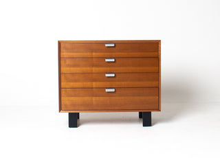 George Nelson Basic Cabinet Series 4 drawer dresser for Herman Miller in restored walnut with black lacquered legs and original aluminum pulls.
