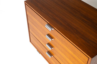 Close-up detail of rift-sawn walnut drawer fronts and original brushed aluminum pulls on George Nelson Basic Cabinet Series dresser.