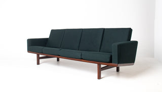 Front view of authentic Hans Wegner GE-236 four-seat sofa by Getama Denmark featuring restored solid teak frame and Maharam Gemma Caliber upholstery.