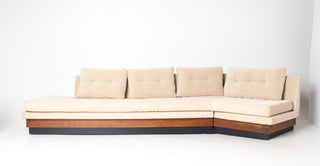 large sofa in walnut and corderoy on white background