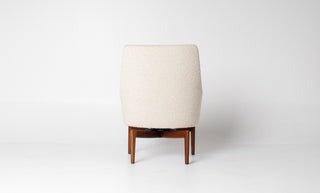back view of White upholstered chair with walnut legs on a white background