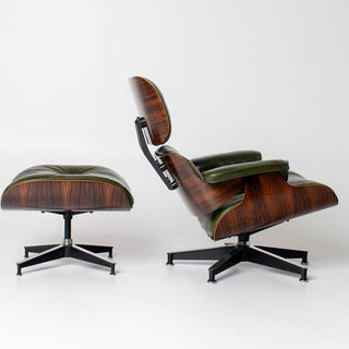 Wooden lounge chair and ottoman with green cushions on a white background