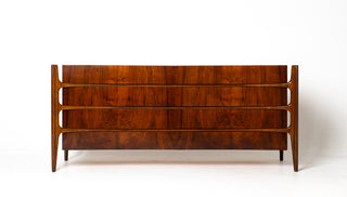 walnut dresser with exoskeletal legs on white background
