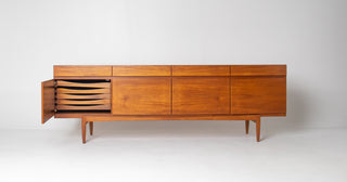 Close-up of sliding door detail on Ib Kofod-Larsen Model 66 credenza in beautifully figured teak.