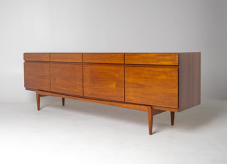 Vintage Danish Modern teak credenza by Ib Kofod-Larsen showing elegant proportions and tapered legs.