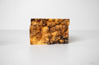 Side profile of Michael Elkan Studio burl wood box showing richly figured burl grain with swirling eye pattern and raw live edge detail