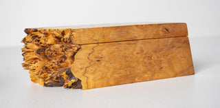Front-facing view of Michael Elkan Studio burl wood box showing sculptural raw live edge end with deeply textured natural wood growth