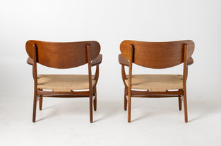 Pair of Hans Wegner CH22 Lounge Chairs in Oak