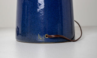 Detail of Gordon and Jane Martz Marshall Studios lamp base showing tapered cobalt blue ceramic form with original brown cloth cord