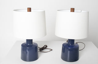 Detail of elongated bottle neck and tapered body of Gordon Martz Marshall Studios cobalt blue ceramic lamp base, showing glaze variation and form