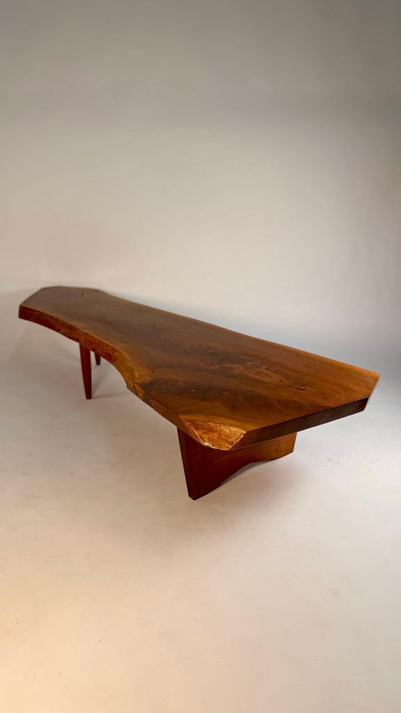 Original George Nakashima Conoid coffee table in English walnut with rosewood butterfly joints, organic freeform top, and rich wood grain, handcrafted circa 1960s.

