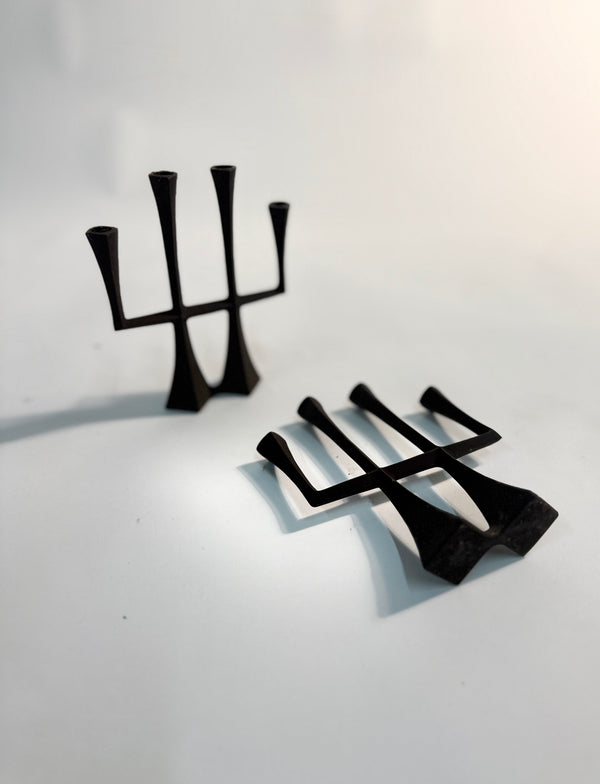 Pair of 1960s Jens Quistgaard for Dansk wrought-iron candleholders, stamped Denmark, minimal mid-century design.