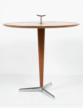 Wooden table with a metal base on a white background