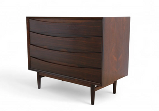 Dark wood dresser with three drawers on a white background