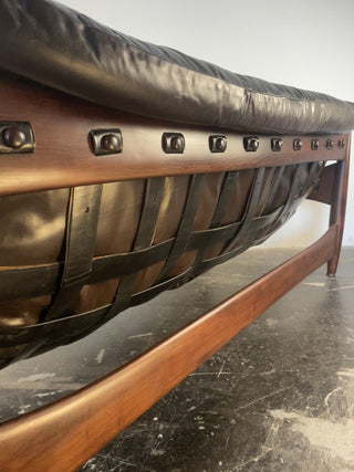 Back view of original leather straps on Sergio Rodrigues Sofa reupholstered in espresso leaather