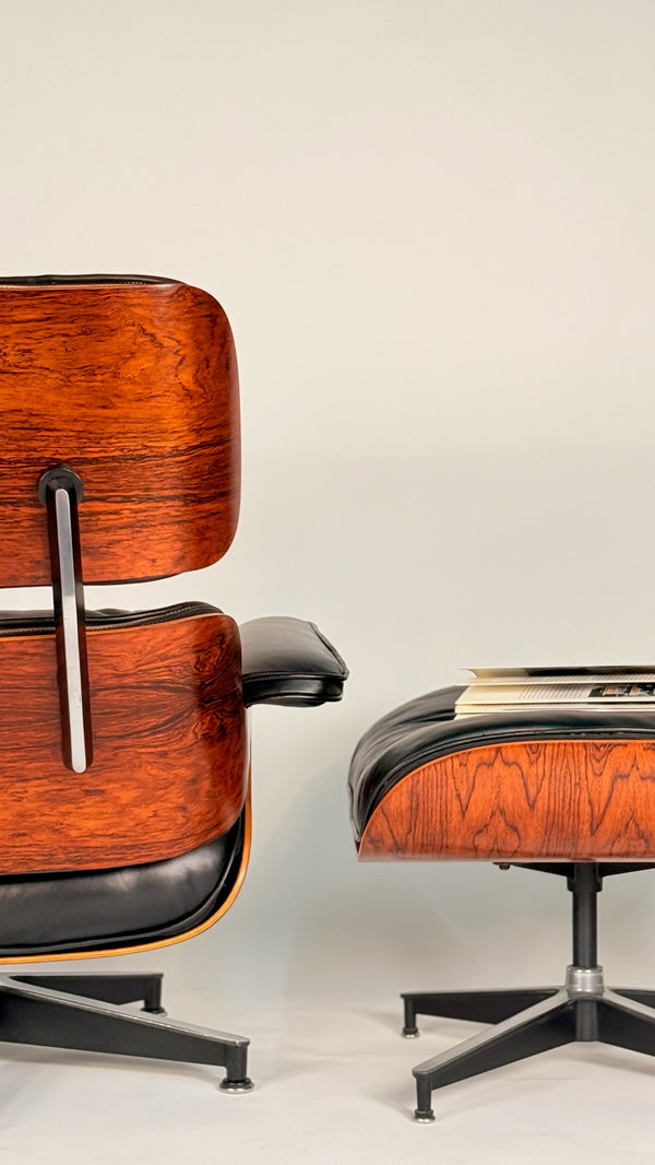 Rosewood Eames Lounge chair and ottoman in rosewood and black leather. fully restored.